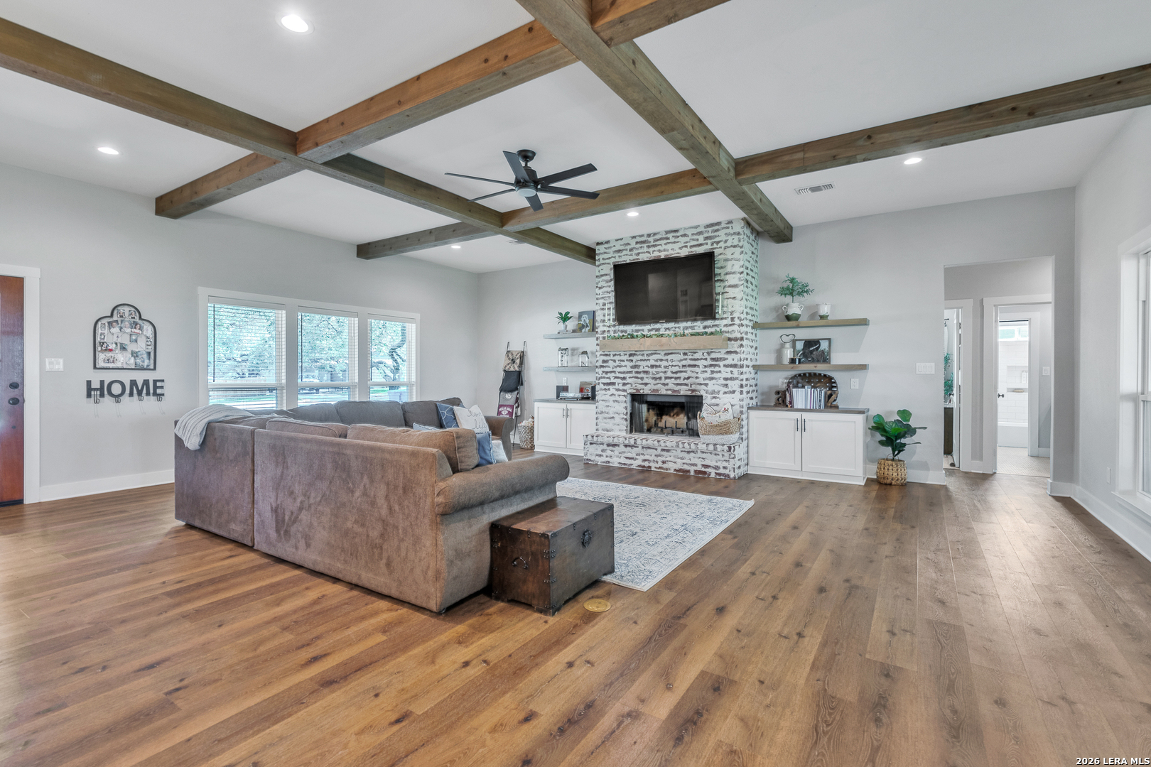 1026 Timbercrest Pleasanton, TX 78064 - Photo 5 of 37 a living room with furniture and a wooden floor
