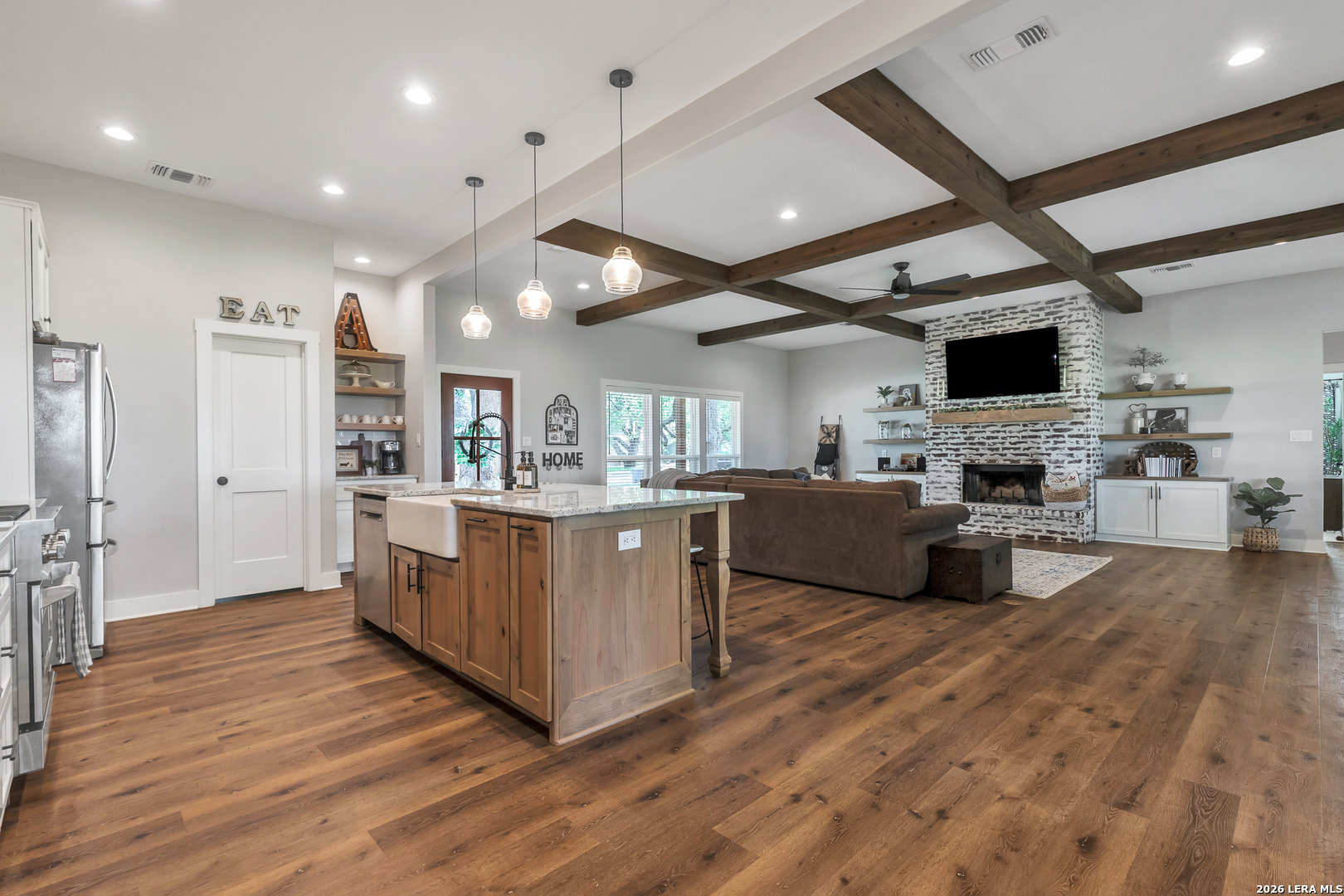 1026 Timbercrest Pleasanton, TX 78064 - Photo 7 of 37 a large kitchen with stainless steel appliances kitchen island granite countertop a large counter top and a stove