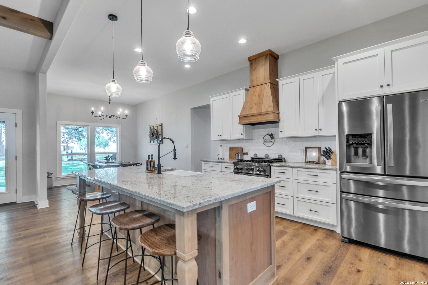 1026 Timbercrest Pleasanton, TX 78064 - Photo 9 of 37 a kitchen with stainless steel appliances granite countertop a stove refrigerator and cabinets