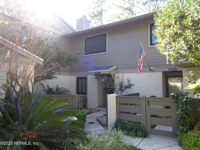 front view of a house with a garden