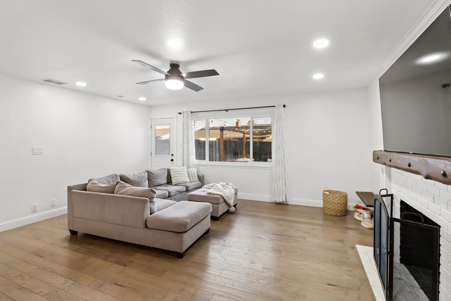5208 Rambler Way Sacramento, CA 95841 - Photo 16 of 51 a living room with furniture and a fireplace