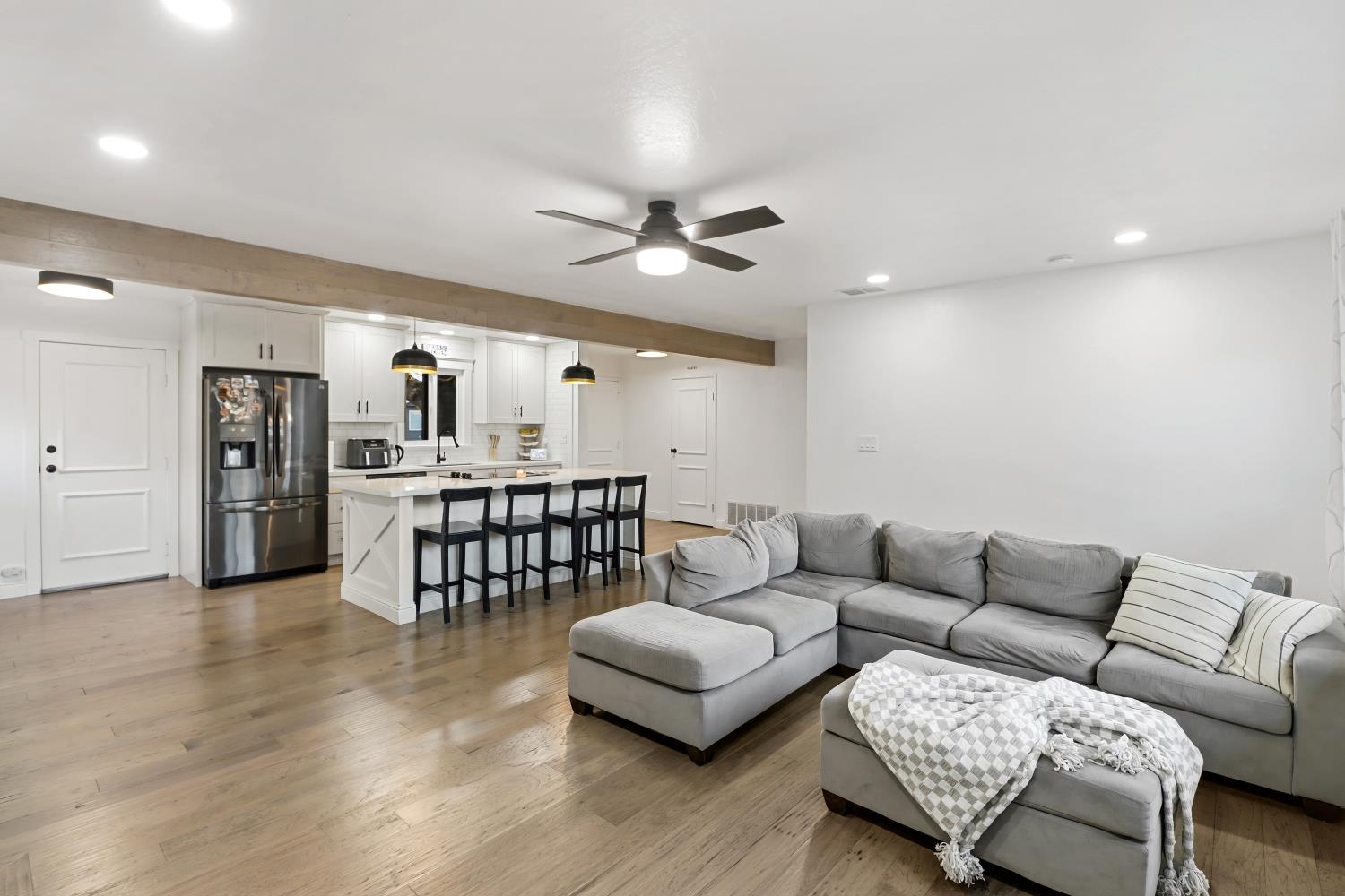 5208 Rambler Way Sacramento, CA 95841 - Photo 17 of 51 a living room with furniture and kitchen view