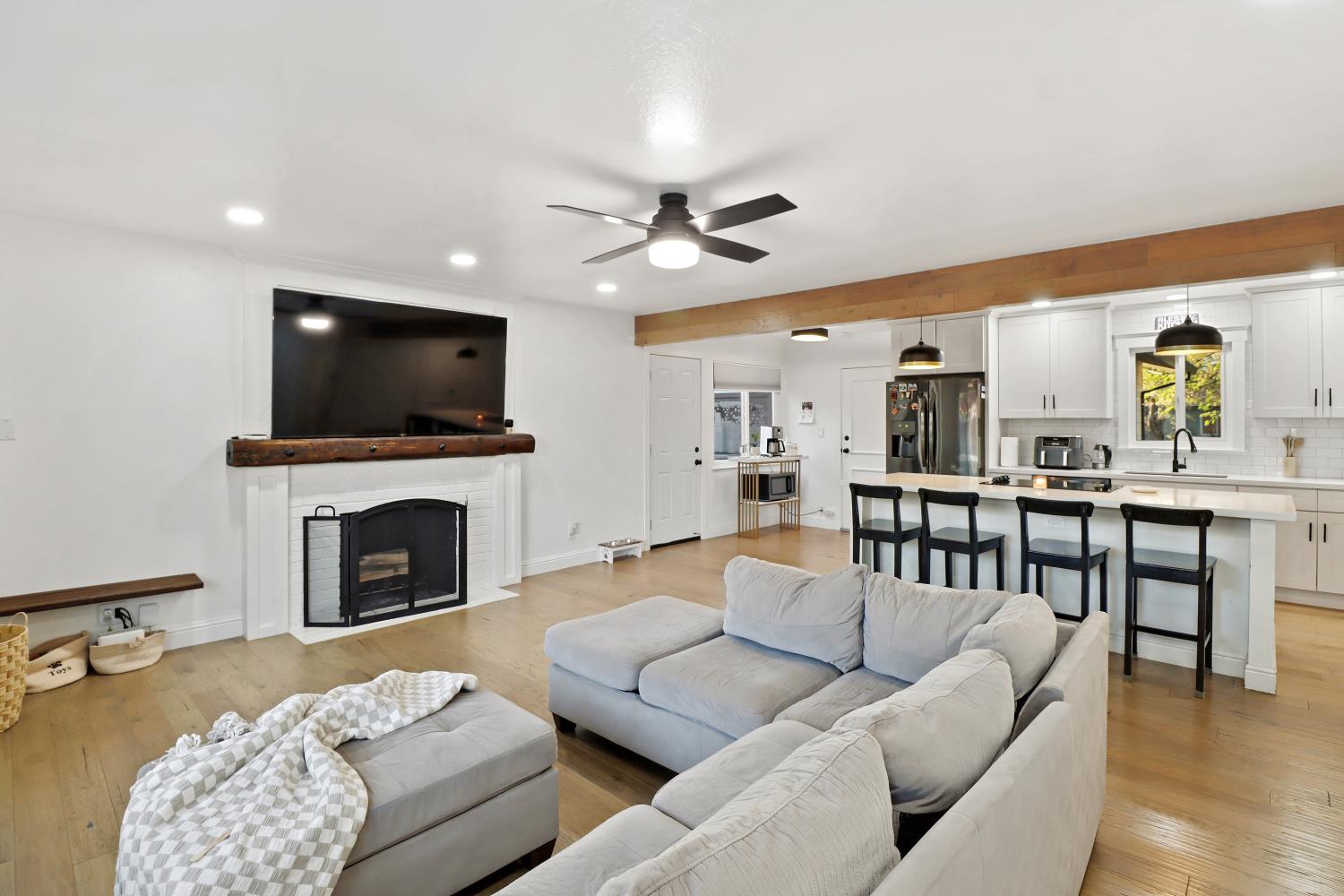 5208 Rambler Way Sacramento, CA 95841 - Photo 18 of 51 a living room with furniture fireplace and a flat screen tv