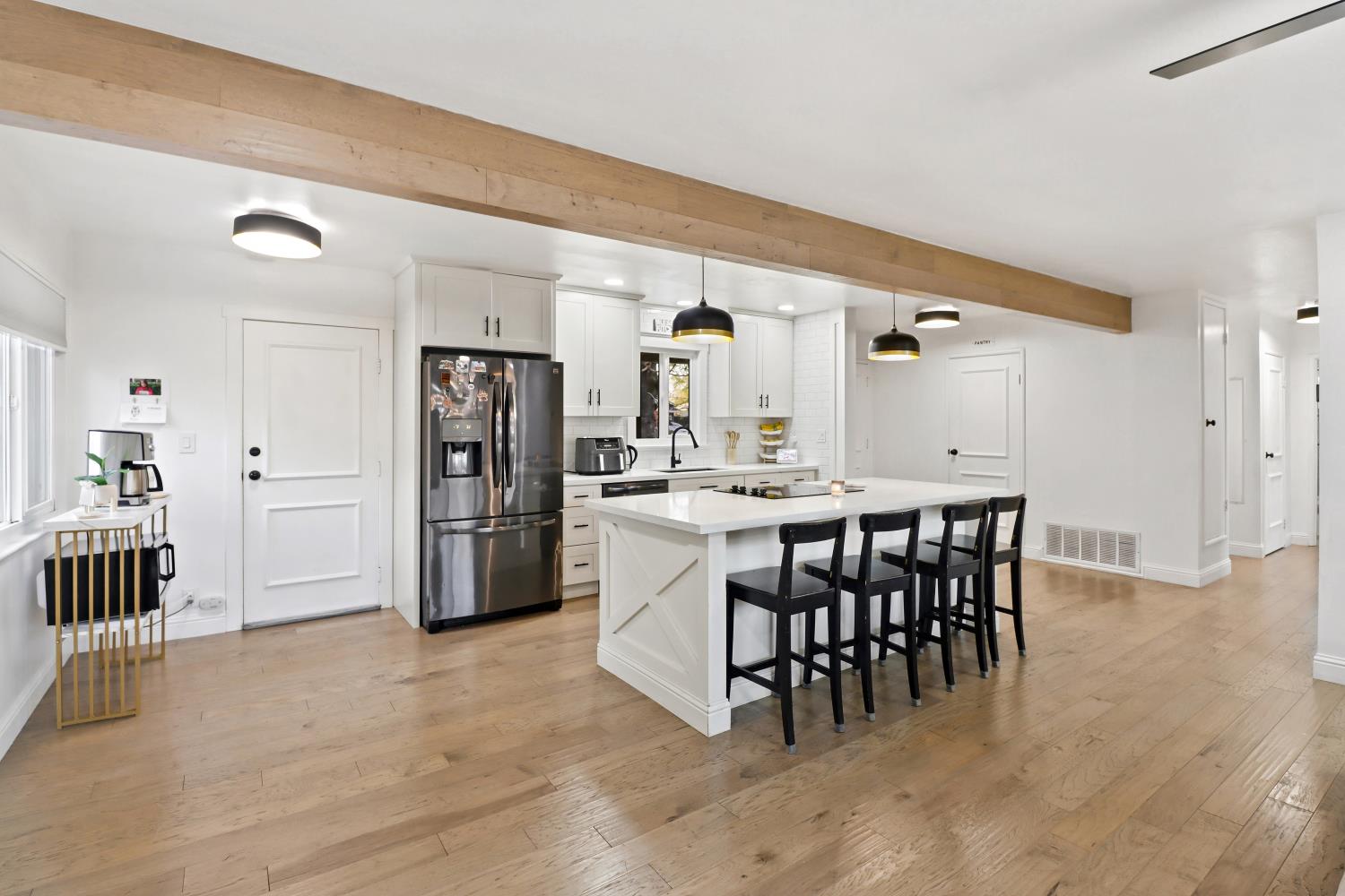 5208 Rambler Way Sacramento, CA 95841 - Photo 19 of 51 a kitchen with a dining table chairs and refrigerator
