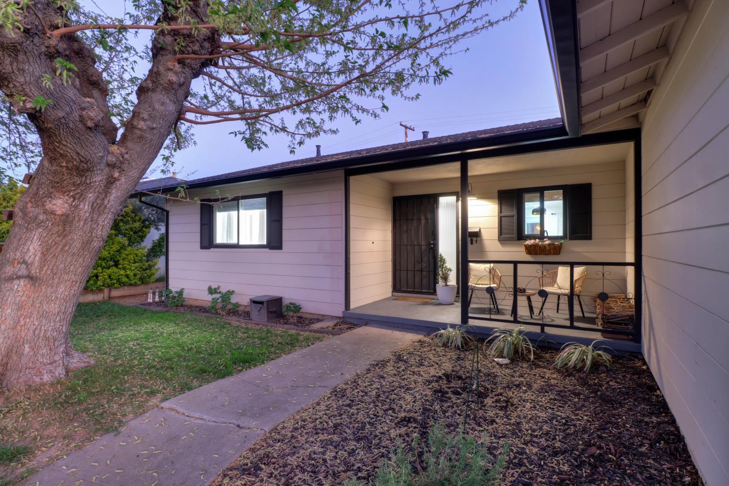 5208 Rambler Way Sacramento, CA 95841 - Photo 2 of 51 a front view of a house with a yard