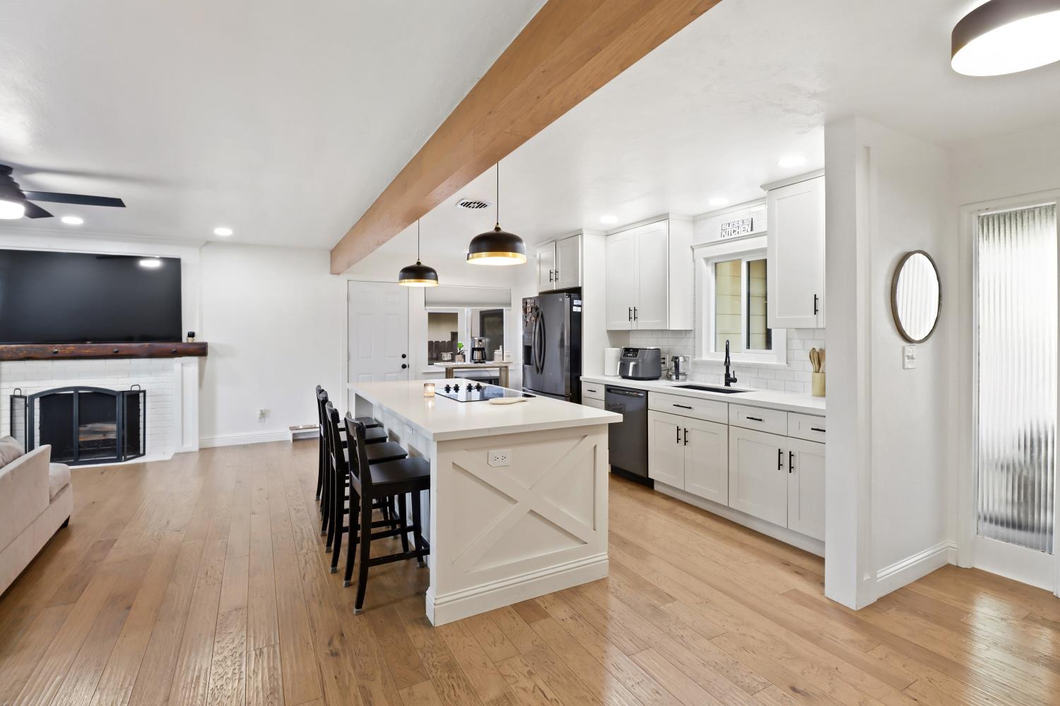 5208 Rambler Way Sacramento, CA 95841 - Photo 24 of 51 a kitchen with a sink cabinets and wooden floor