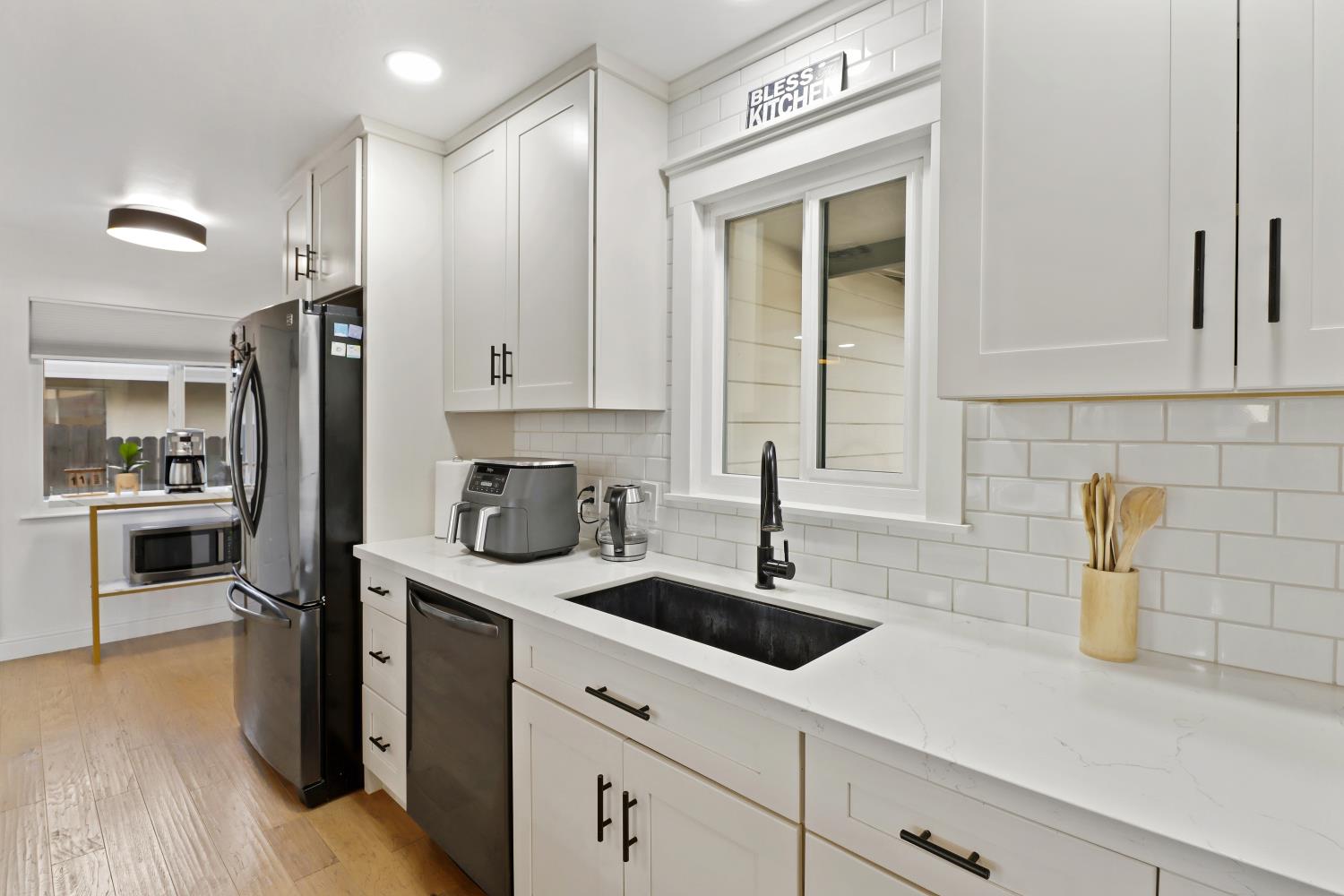 5208 Rambler Way Sacramento, CA 95841 - Photo 25 of 51 a kitchen with sink and cabinets