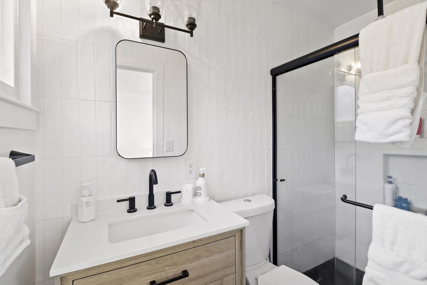 5208 Rambler Way Sacramento, CA 95841 - Photo 33 of 51 a bathroom with a sink and a mirror