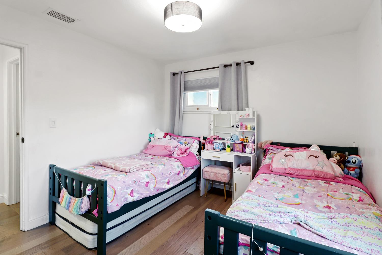 5208 Rambler Way Sacramento, CA 95841 - Photo 40 of 51 a bedroom with a bed and a dresser