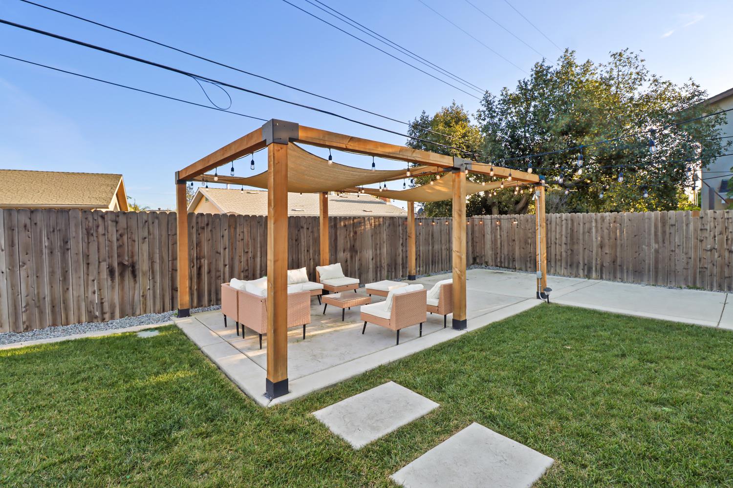 5208 Rambler Way Sacramento, CA 95841 - Photo 43 of 51 a view of a chair and table in backyard of the house