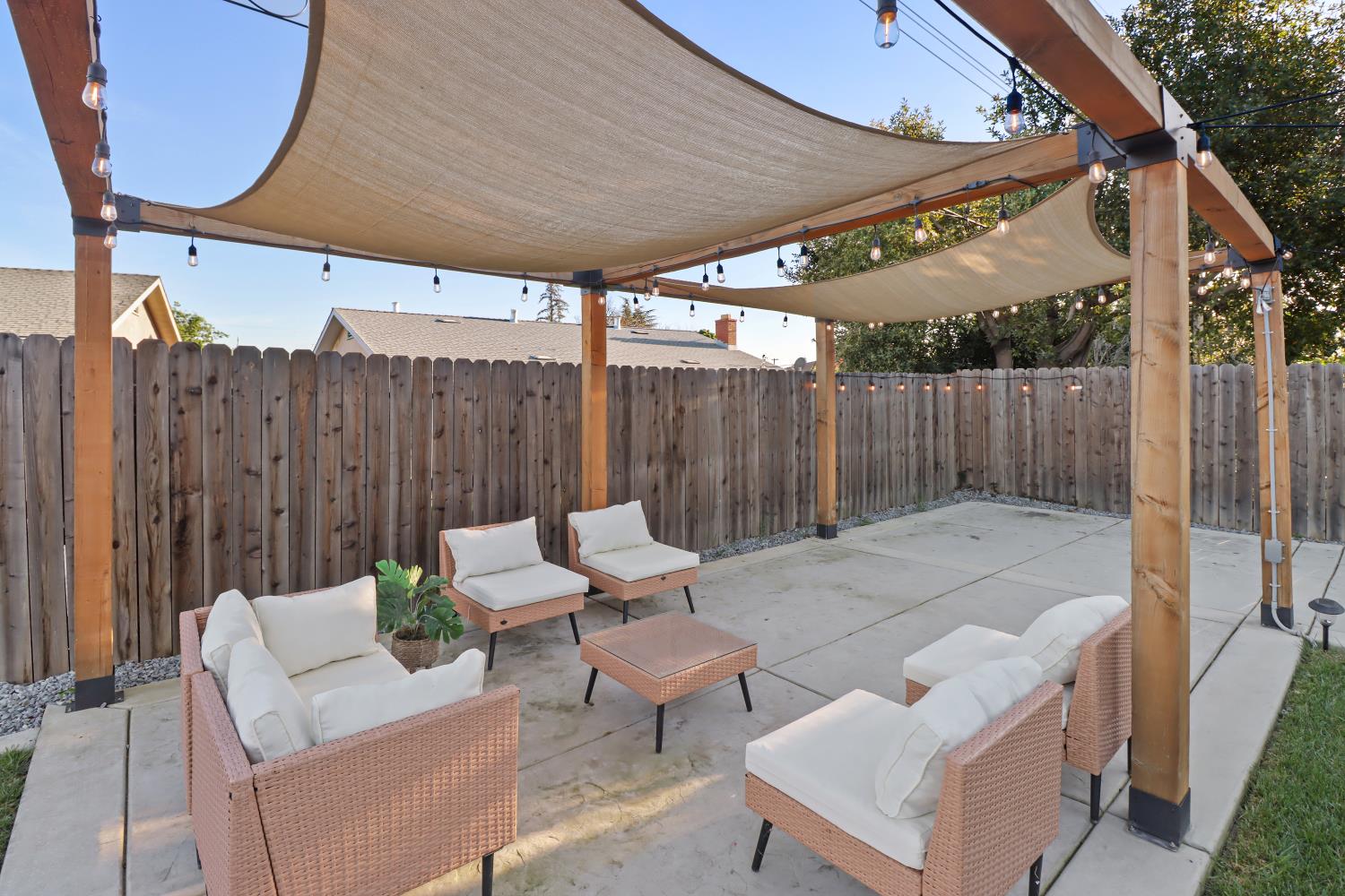 5208 Rambler Way Sacramento, CA 95841 - Photo 44 of 51 a view of a patio with a table and chairs
