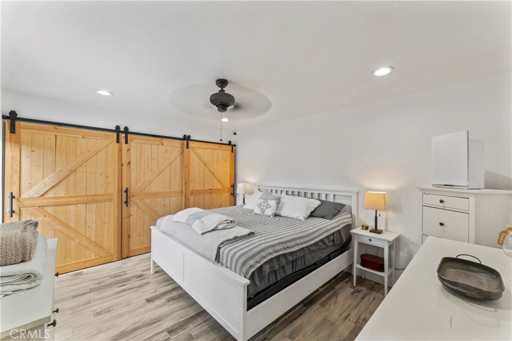 14456 Foothill, Unit 47 Sylmar, CA 91342 - Photo 13 of 26 a bed room with a bed and a chair