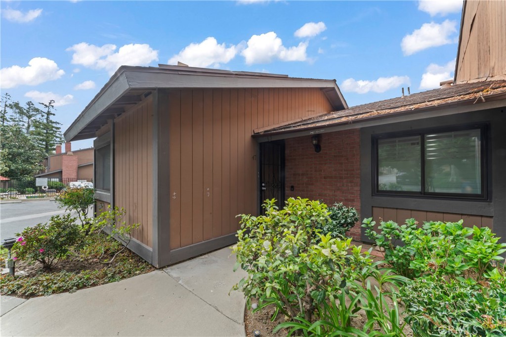 14456 Foothill, Unit 47 Sylmar, CA 91342 - Photo 26 of 26 a front view of a house with garden