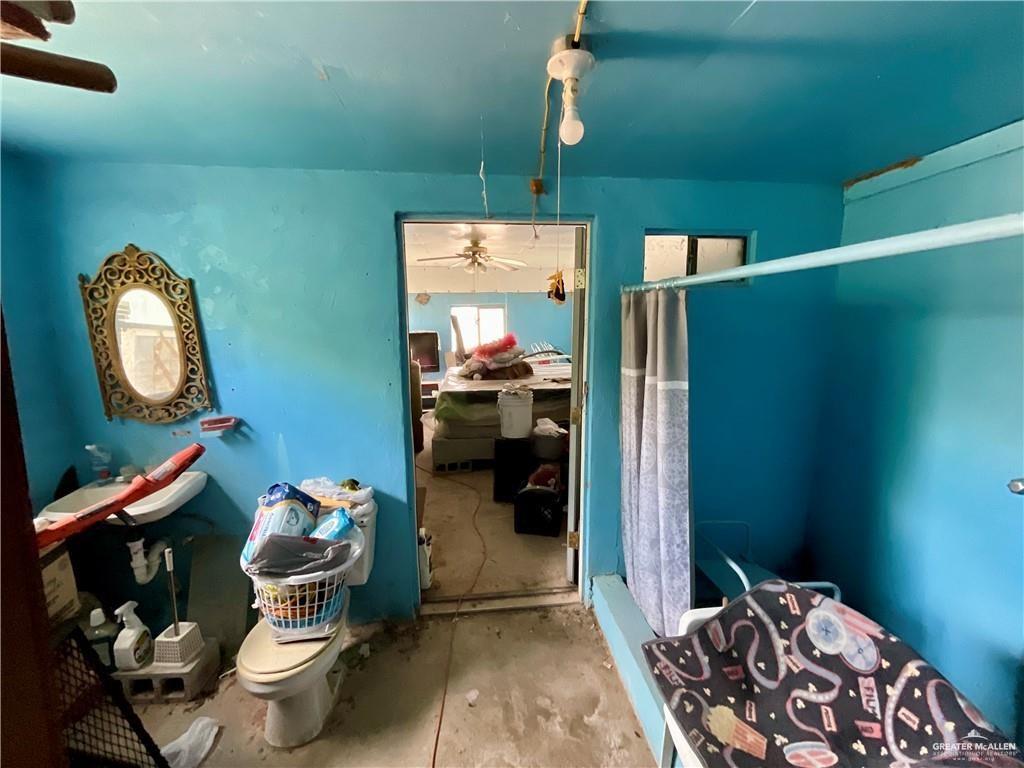 5146 Jm Martinez Street, Unit J Rio Grande City, TX 78582 - Photo 13 of 13 a bedroom with a bed and a mirror