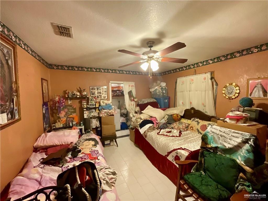 5146 Jm Martinez Street, Unit J Rio Grande City, TX 78582 - Photo 7 of 13 a view of a livingroom with furniture and a ceiling fan