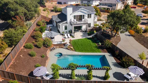 an aerial view of residential house with outdoor space and street view