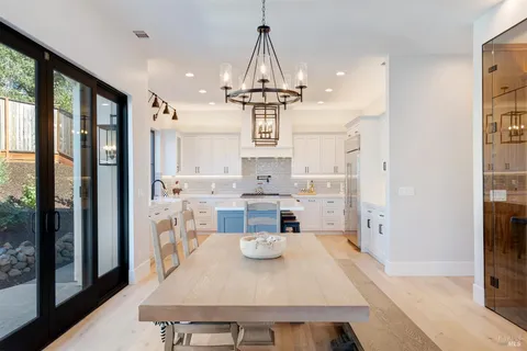 a kitchen with stainless steel appliances a refrigerator and a stove
