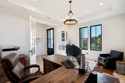 a view of entryway livingroom and hall with wooden floor