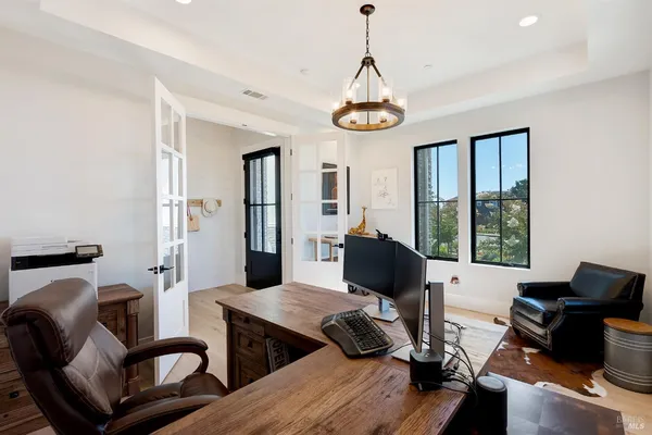 a view of entryway livingroom and hall with wooden floor