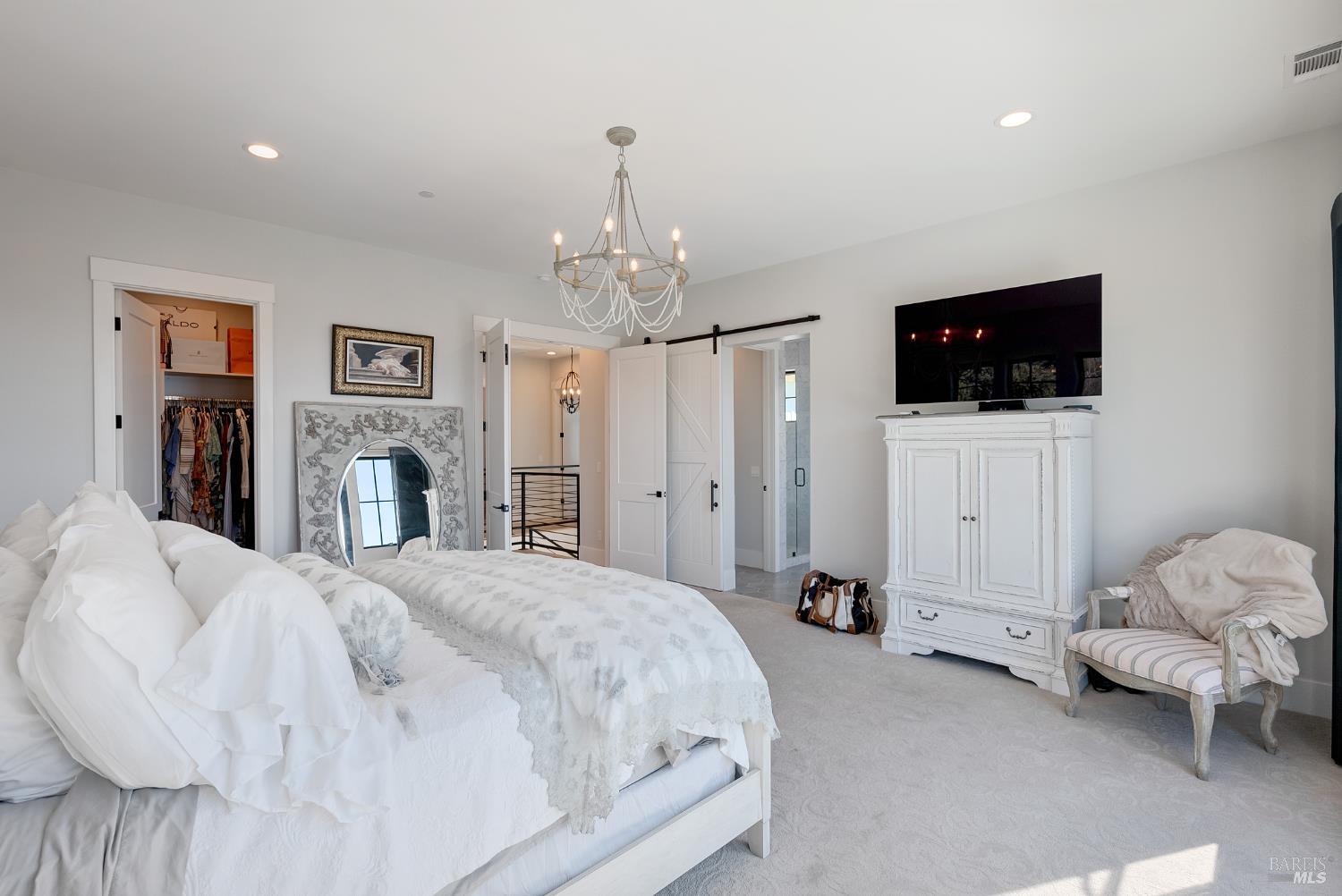 3724 Stanhope Court Santa Rosa, CA 95404 - Photo 40 of 78 a spacious bedroom with a bed and a flat screen tv