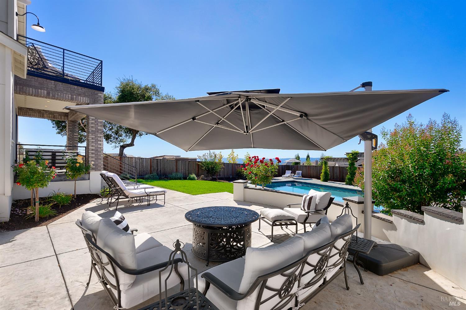 3724 Stanhope Court Santa Rosa, CA 95404 - Photo 54 of 78 a view of patio with chairs and table under an umbrella