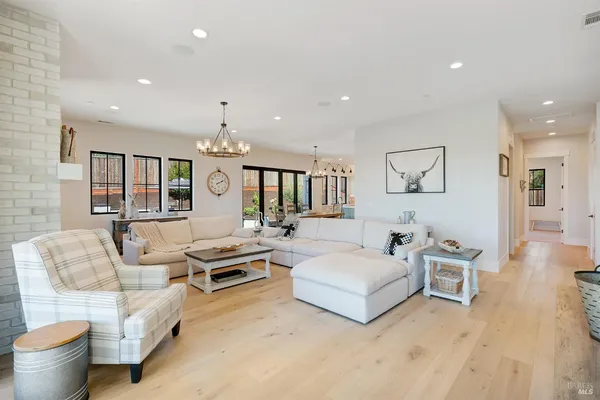 a living room with furniture fireplace and flat screen tv