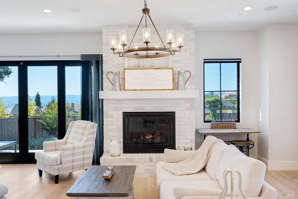 a living room with couch and a floor to ceiling window