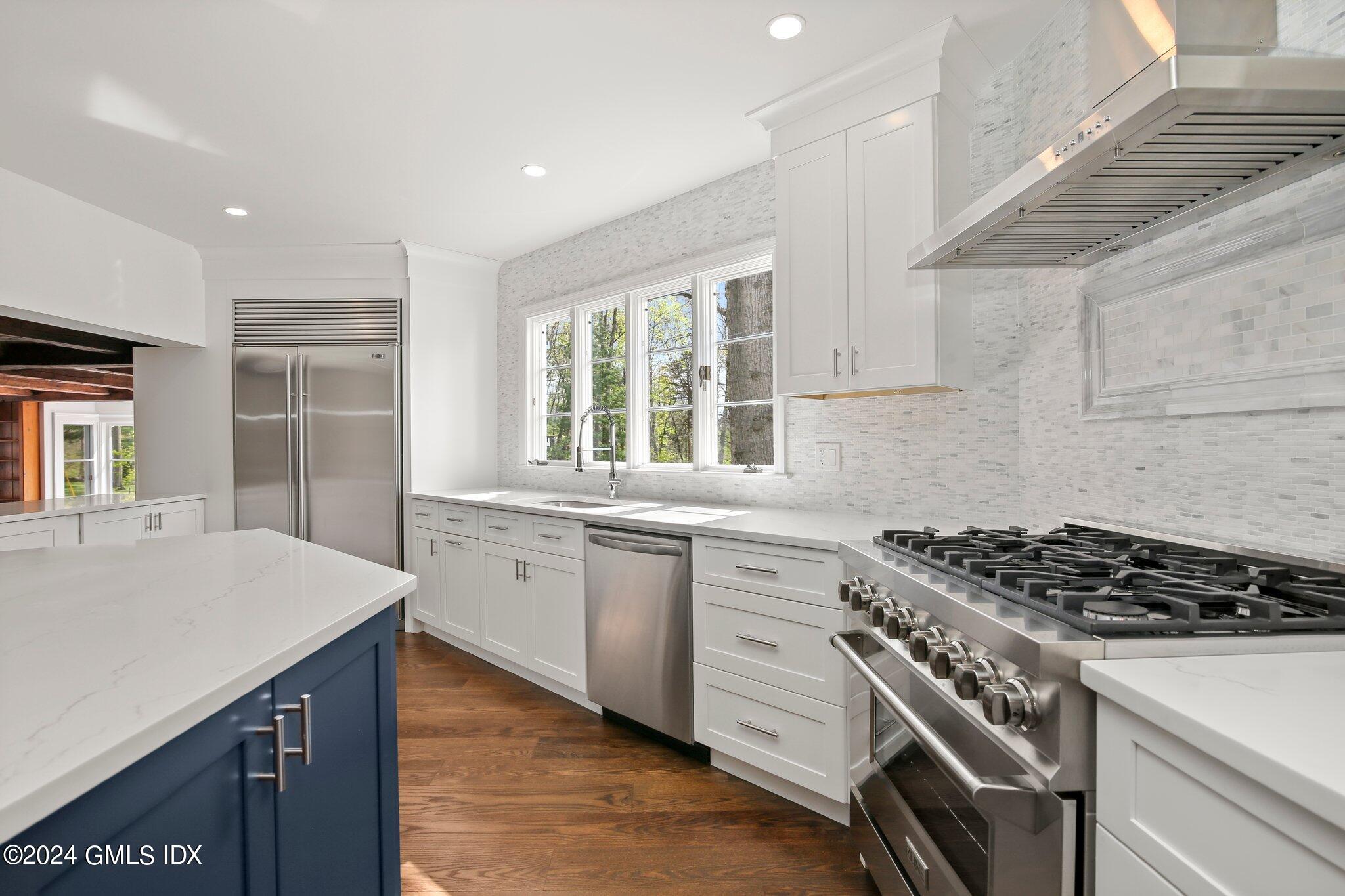 69 Clapboard Ridge Road Greenwich, CT 06830 - Photo 11 of 40 a kitchen with a stove a sink and a refrigerator