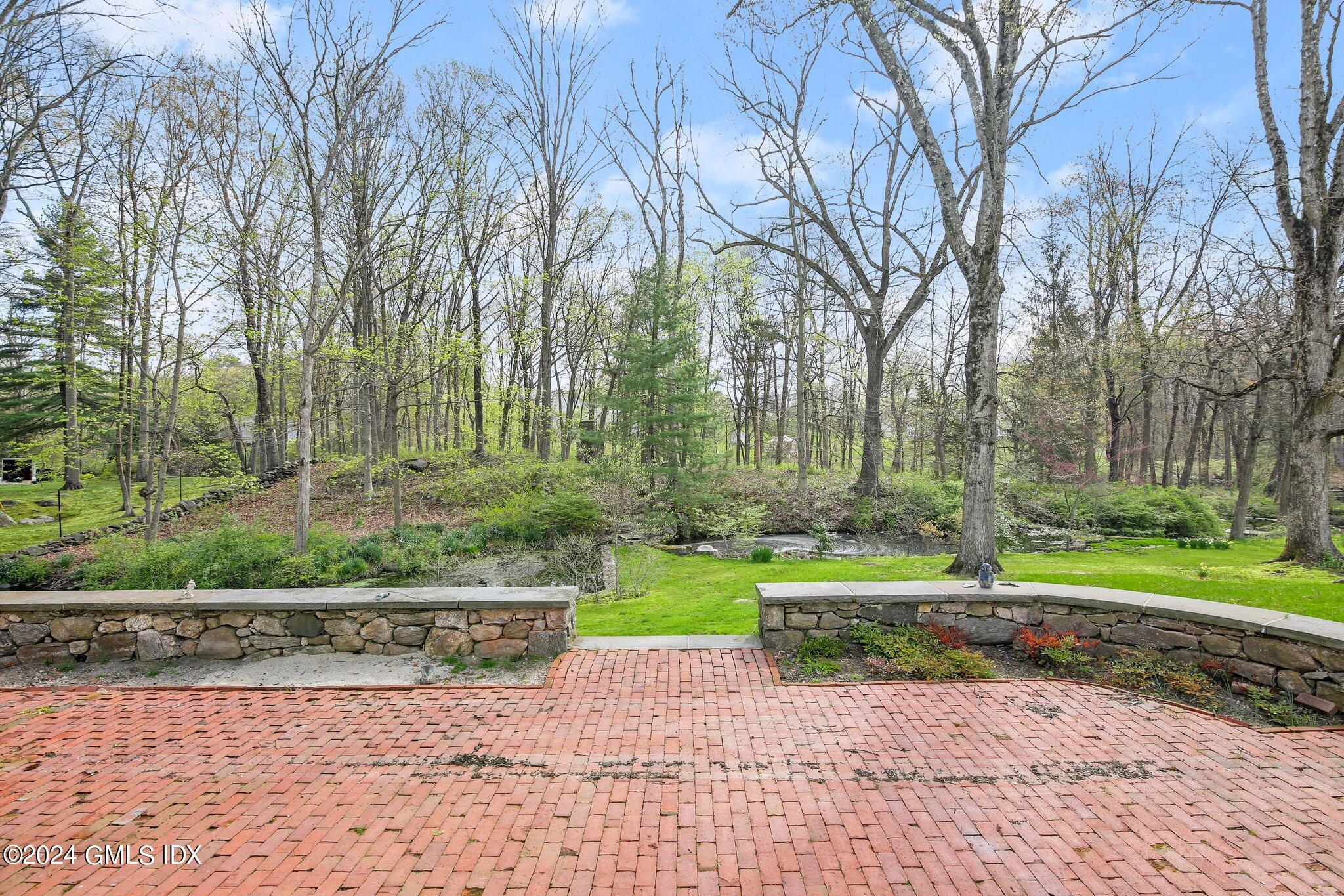 69 Clapboard Ridge Road Greenwich, CT 06830 - Photo 14 of 40 a view of a park with large trees
