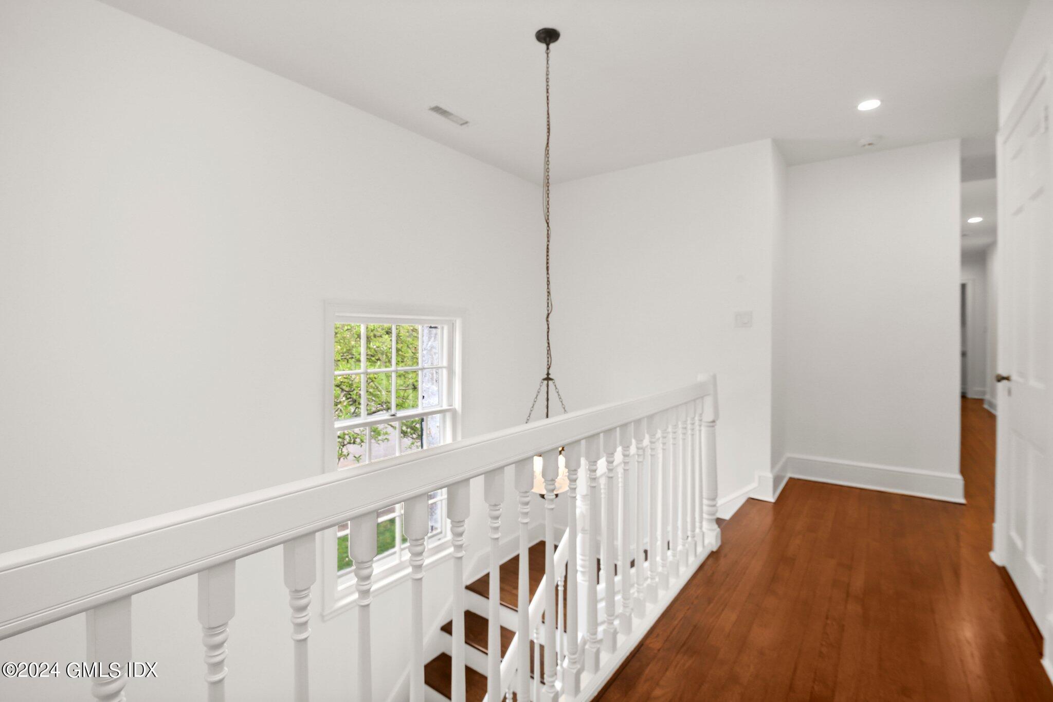69 Clapboard Ridge Road Greenwich, CT 06830 - Photo 18 of 40 a view of hallway with wooden floor