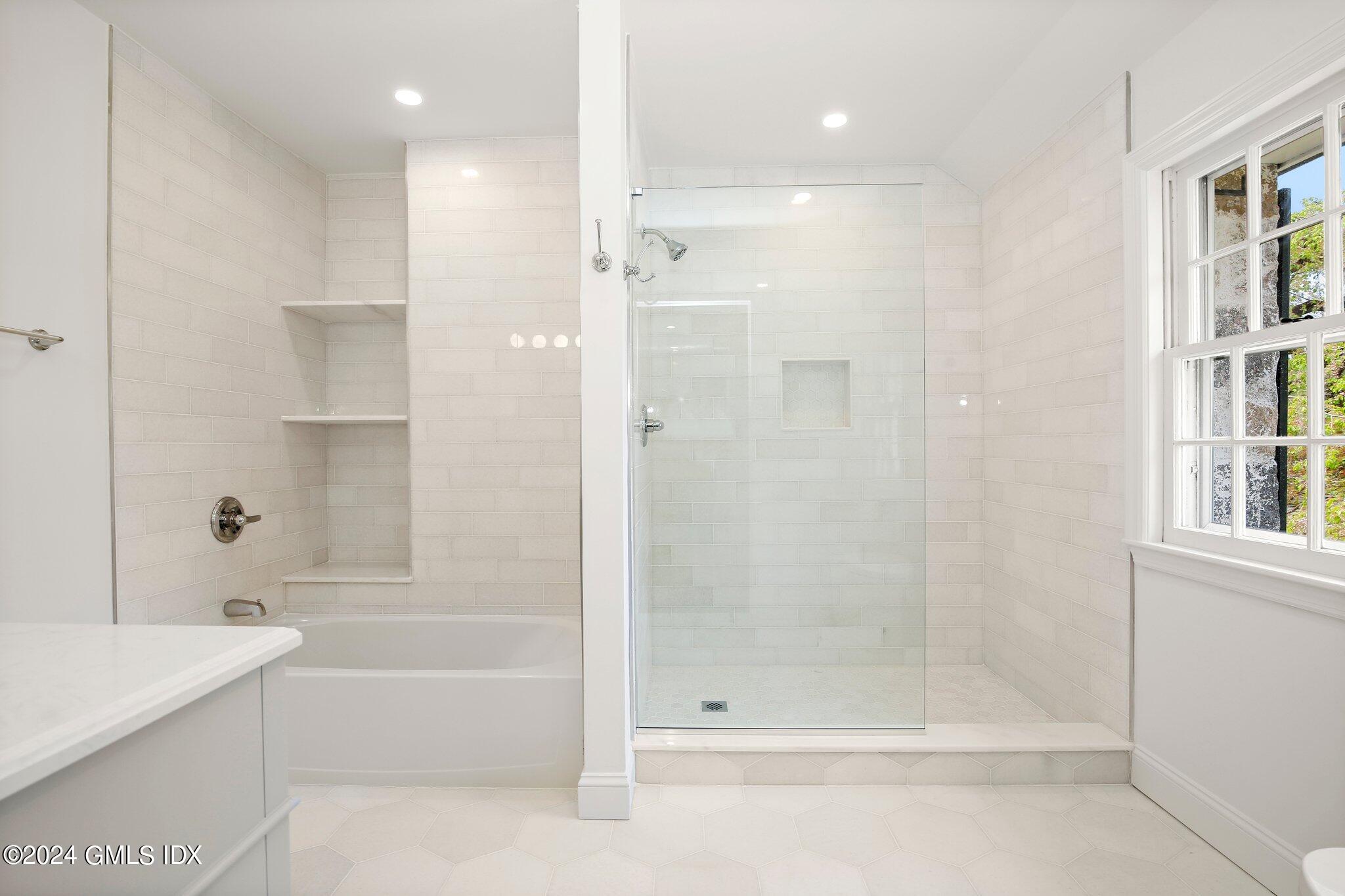 69 Clapboard Ridge Road Greenwich, CT 06830 - Photo 21 of 40 a bathroom with a bathtub and a shower