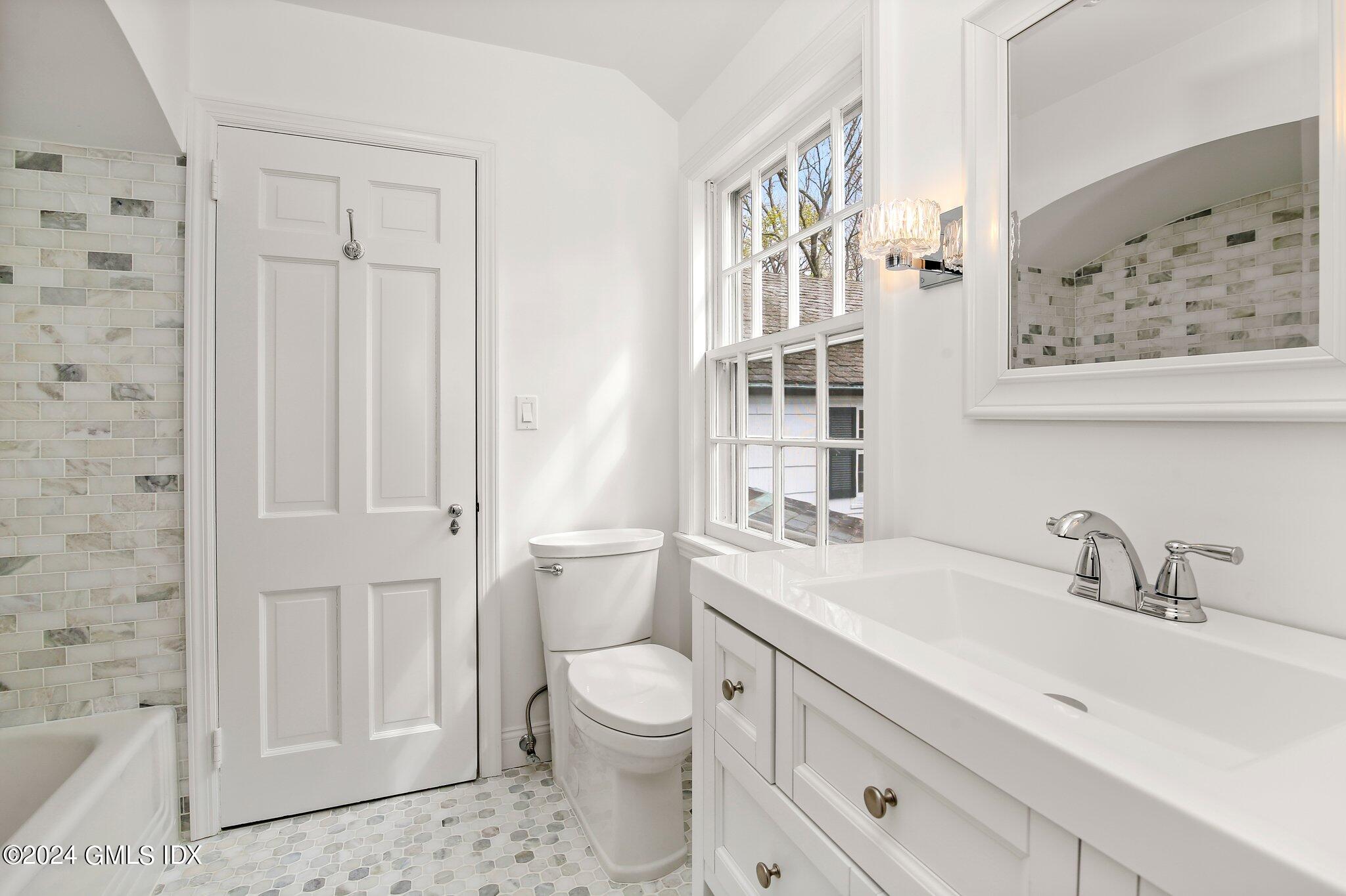 69 Clapboard Ridge Road Greenwich, CT 06830 - Photo 23 of 40 a bathroom with a sink a toilet and shower