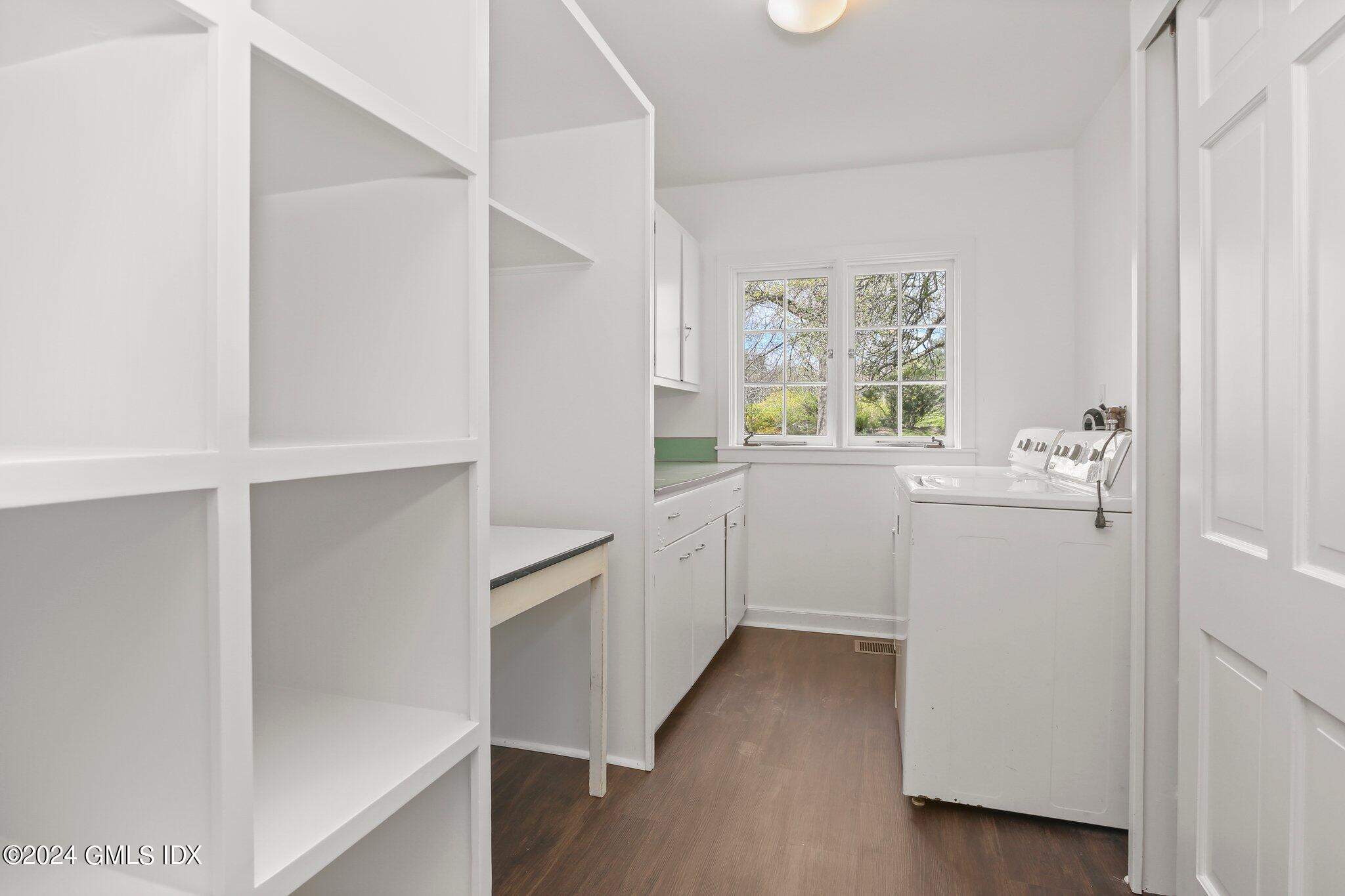 69 Clapboard Ridge Road Greenwich, CT 06830 - Photo 27 of 40 a view of a kitchen with a white wooden cabinets and a window