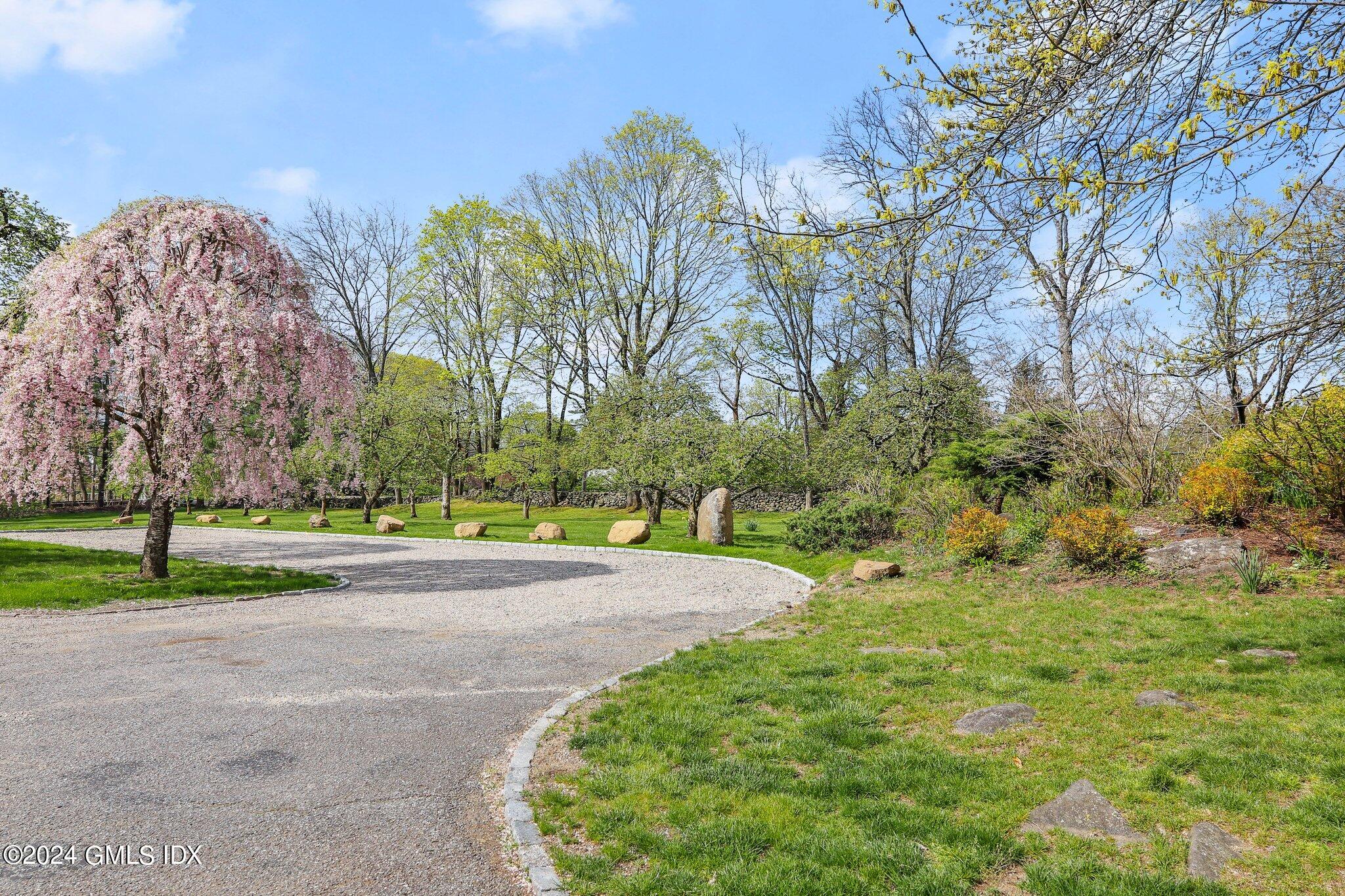 69 Clapboard Ridge Road Greenwich, CT 06830 - Photo 29 of 40 a view of a yard with large trees