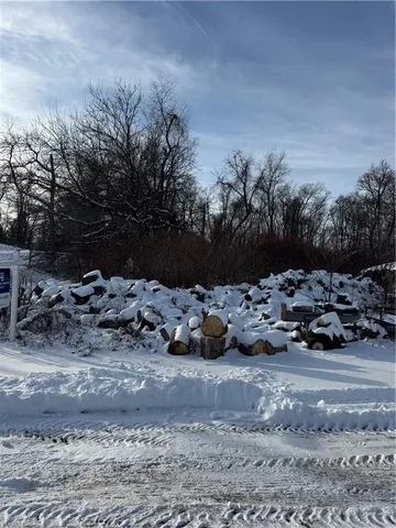 a view of cars parked in a dirt yard