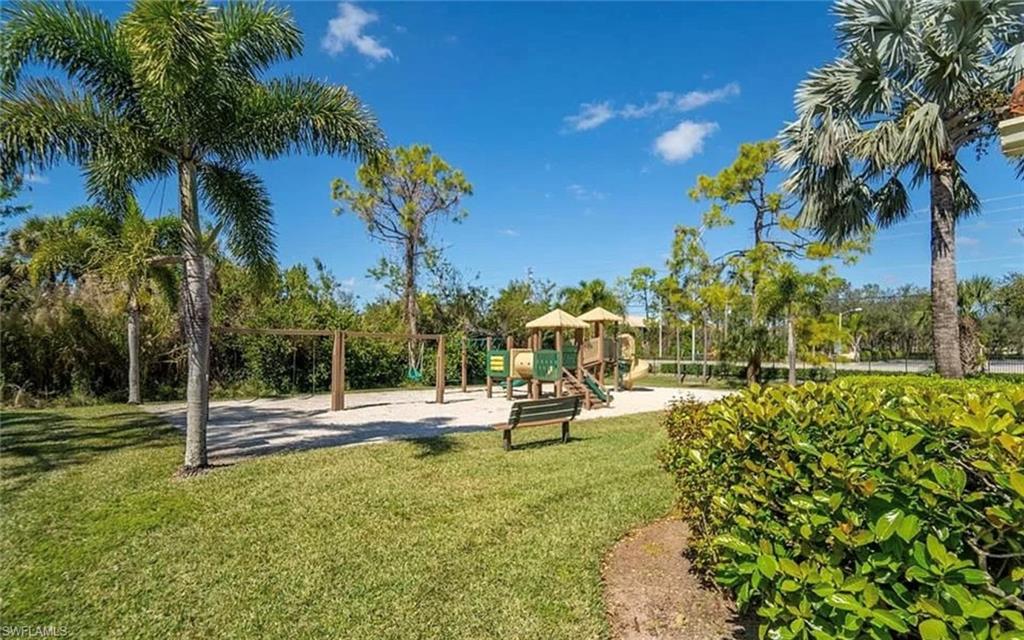 8255 Ibis Club Drive, Unit 504 Naples, FL 34104 - Photo 4 of 4 a view of a park with swings and slides