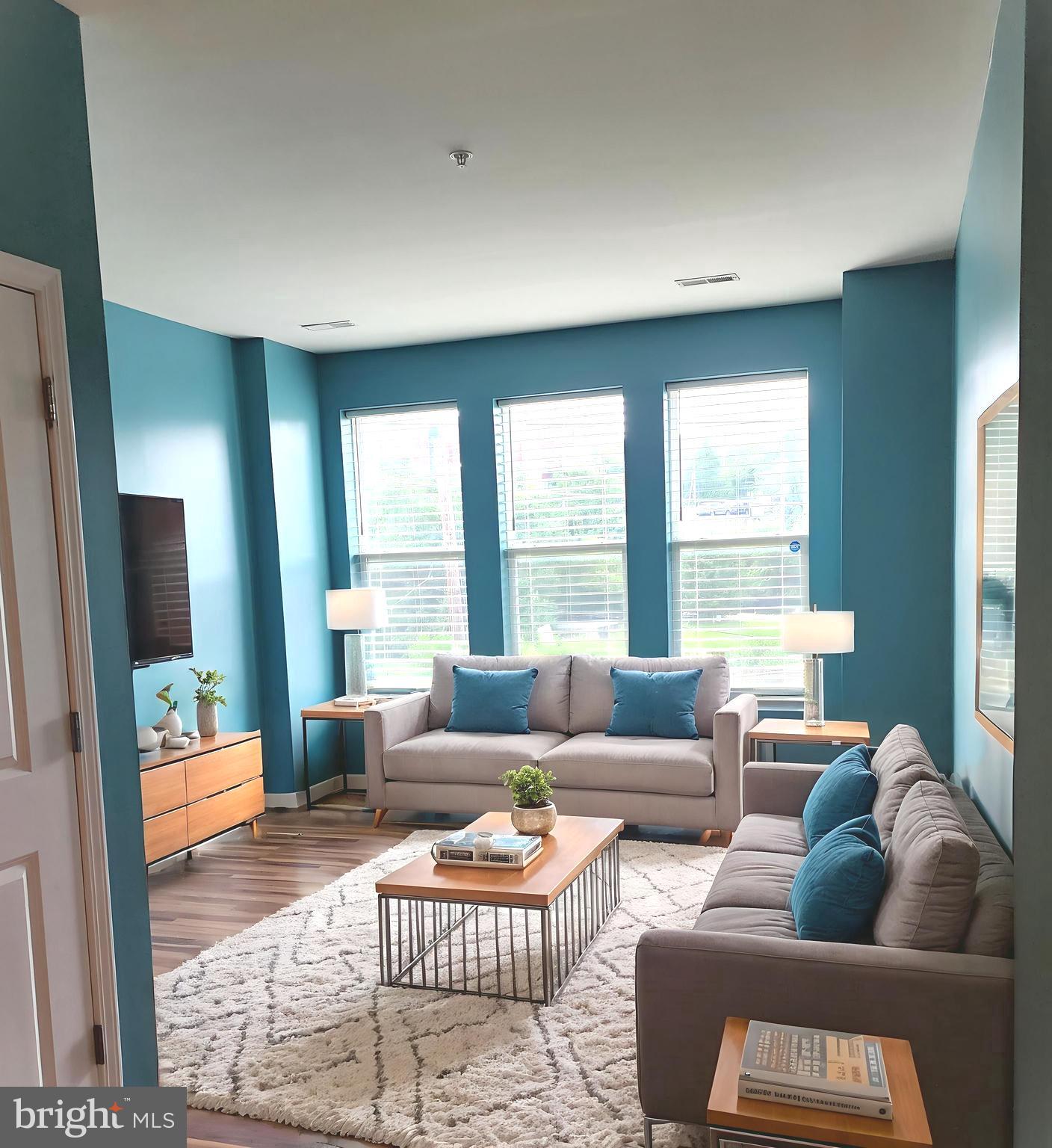 2610 Sheridan Road Southeast, Unit 3 Washington, DC 20020 - Photo 1 of 30 a living room with furniture and a large window