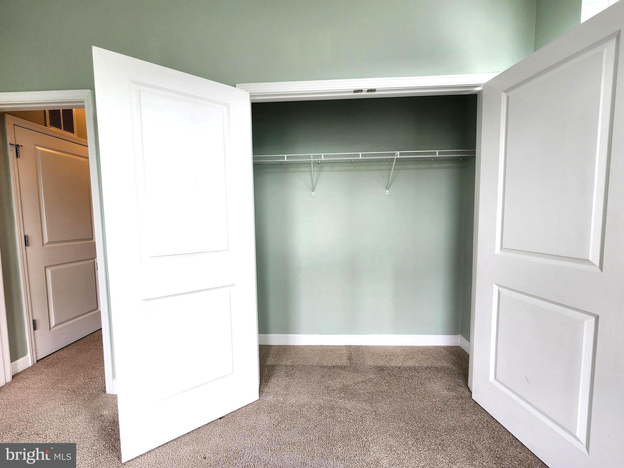 2610 Sheridan Road Southeast, Unit 3 Washington, DC 20020 - Photo 22 of 30 a room with a wooden floor and a refrigerator