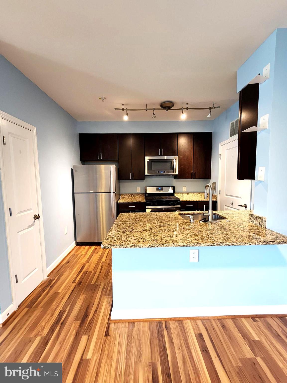 2610 Sheridan Road Southeast, Unit 3 Washington, DC 20020 - Photo 3 of 30 a view of kitchen with microwave and refrigerator