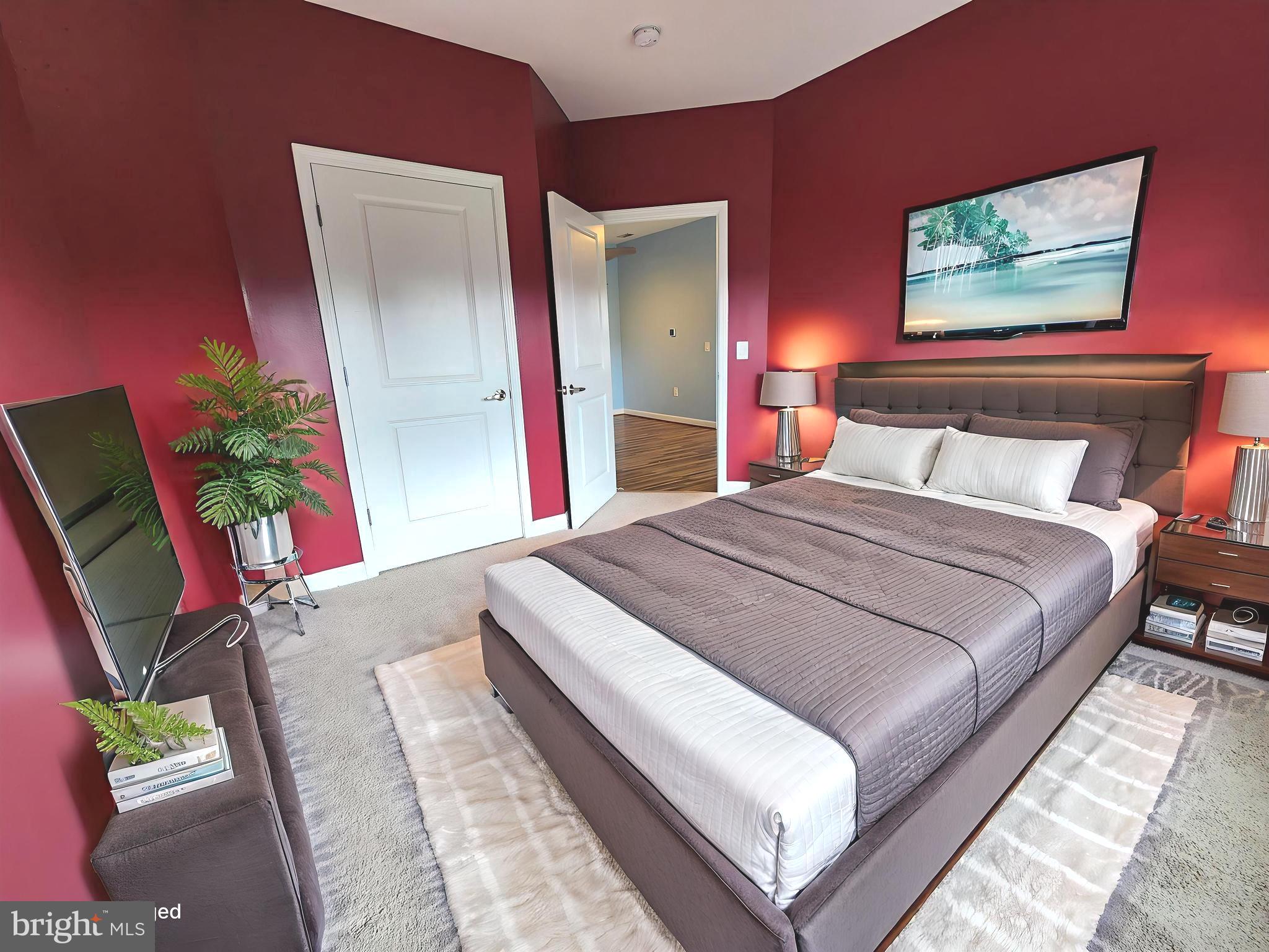 2610 Sheridan Road Southeast, Unit 3 Washington, DC 20020 - Photo 9 of 30 a bedroom with bed and a potted plant