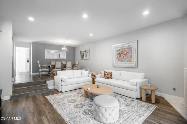 a living room with furniture and a rug