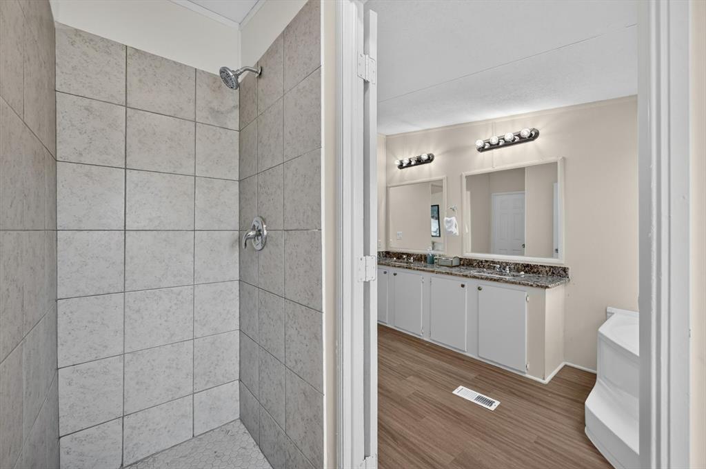 13405 Wheat Road Venus, TX 76084 - Photo 28 of 32 Tiled walk-in shower featuring a chrome showerhead and control
