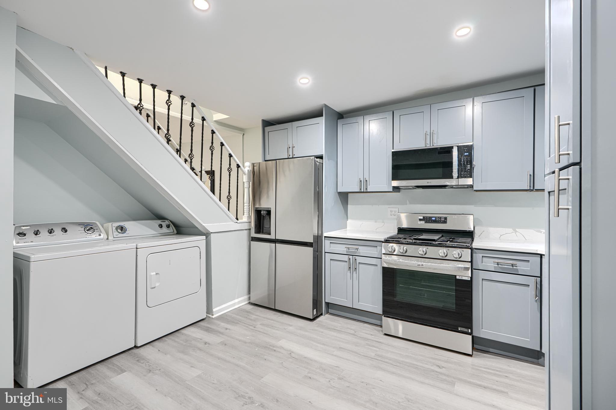 3606 Old York Road Baltimore, MD 21218 - Photo 13 of 35 a kitchen with stainless steel appliances a stove microwave and refrigerator