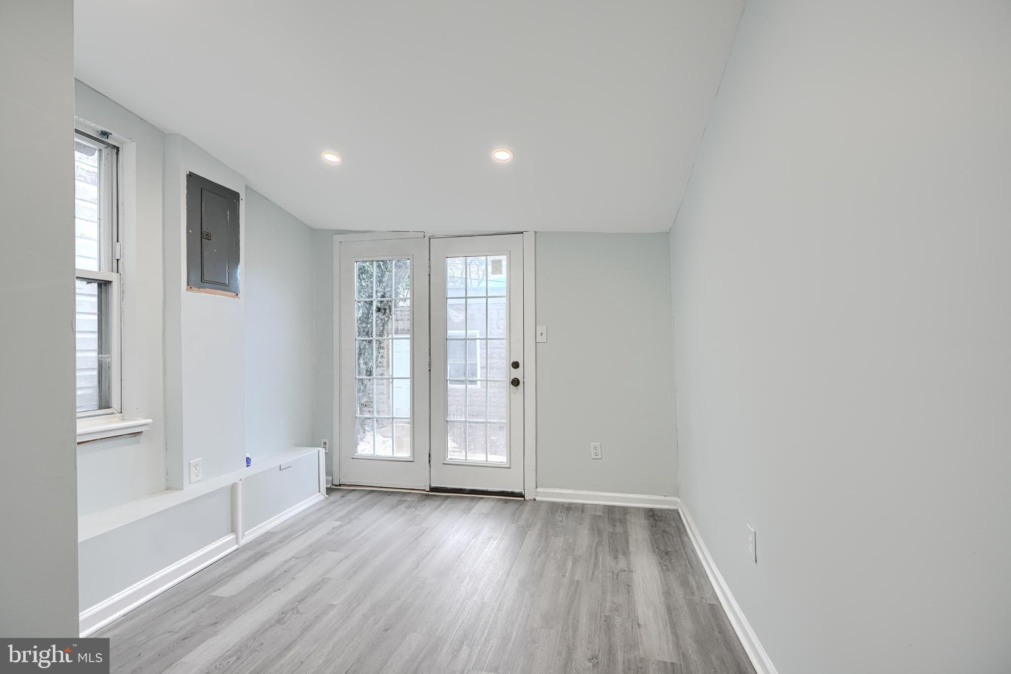 3606 Old York Road Baltimore, MD 21218 - Photo 18 of 35 a view of an empty room with wooden floor and a window