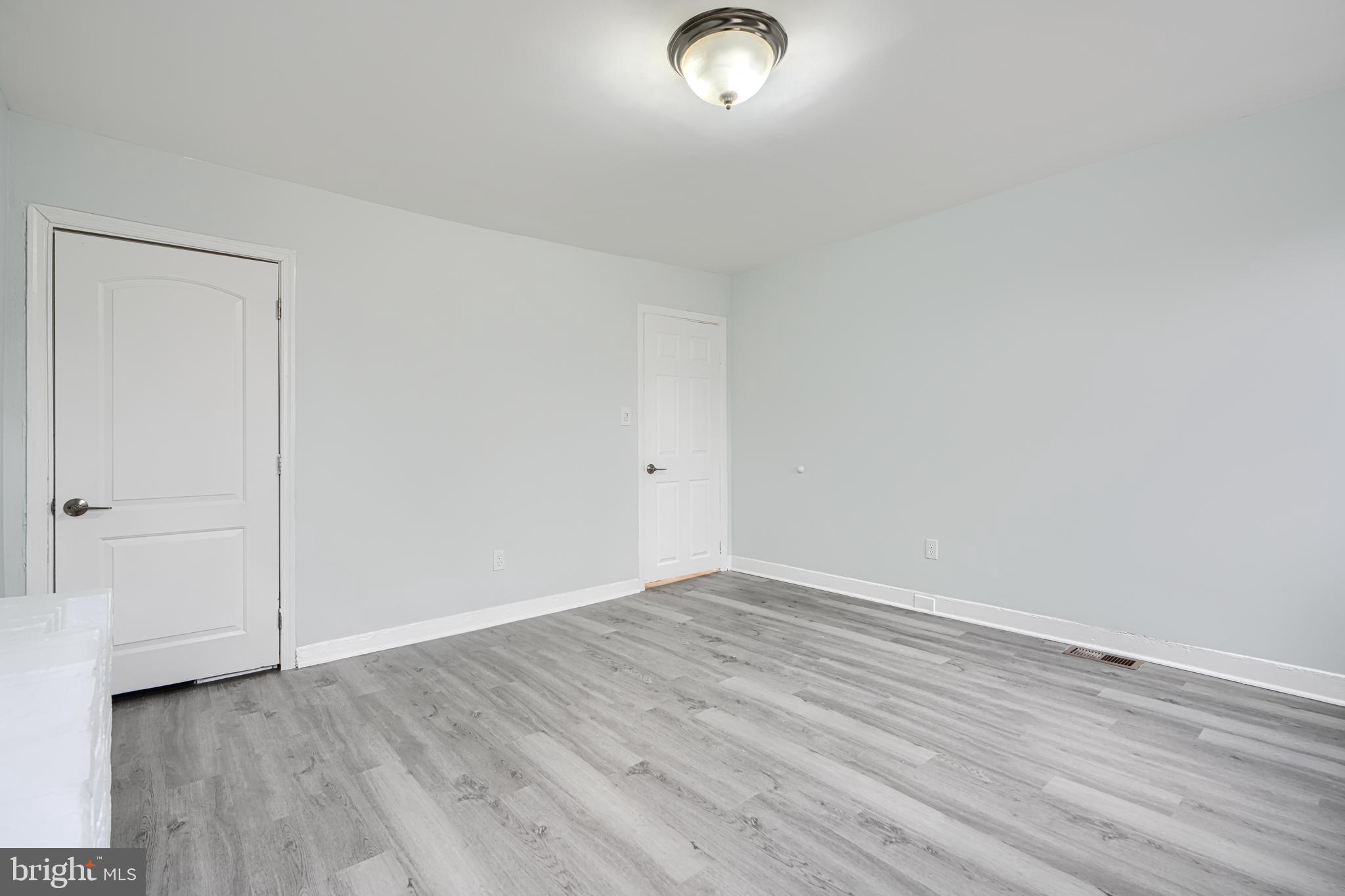 3606 Old York Road Baltimore, MD 21218 - Photo 23 of 35 a view of an empty room with wooden floor