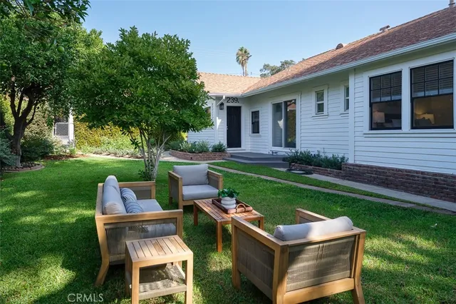 a kitchen with a sink cabinets and wooden floor