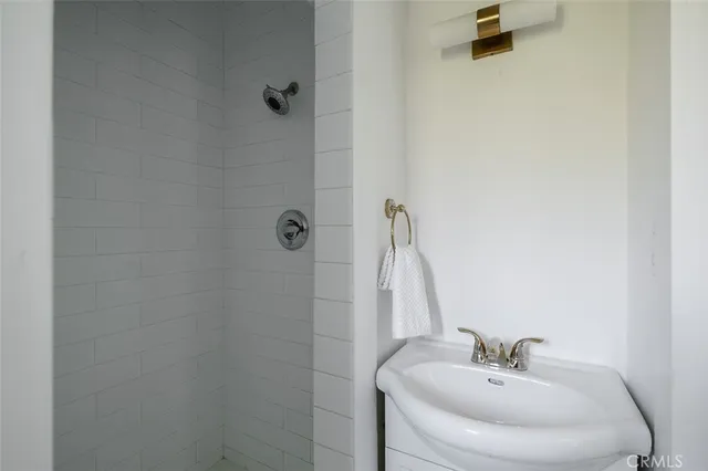 a kitchen with stainless steel appliances a refrigerator and a dining table