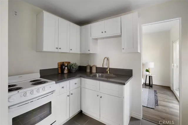 a bathroom with a tub a sink and a mirror