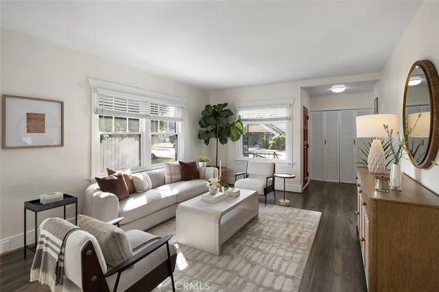 a dining room with furniture and wooden floor