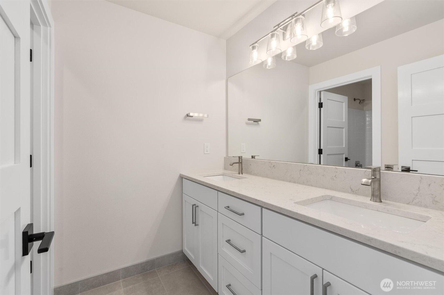 421 Rockefeller Avenue Everett, WA 98201 - Photo 28 of 40 a bathroom with a double vanity sink and a mirror